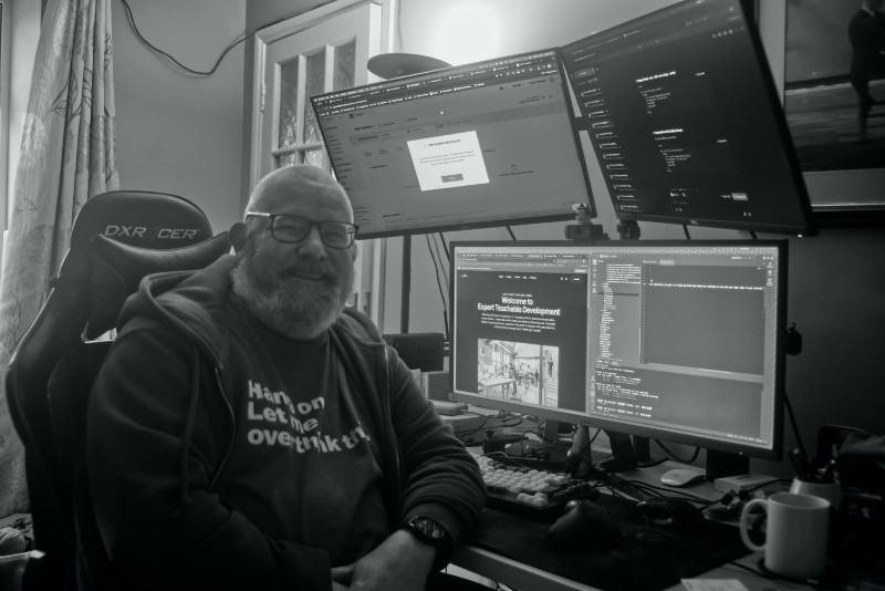 Tom sitting at his home office desk